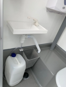 CONTENEDOR WC CON CISTERNA CABINA