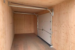 CONTENEDOR DE 20 PIES CON PUERTAS DE GARAJE AISLADAS